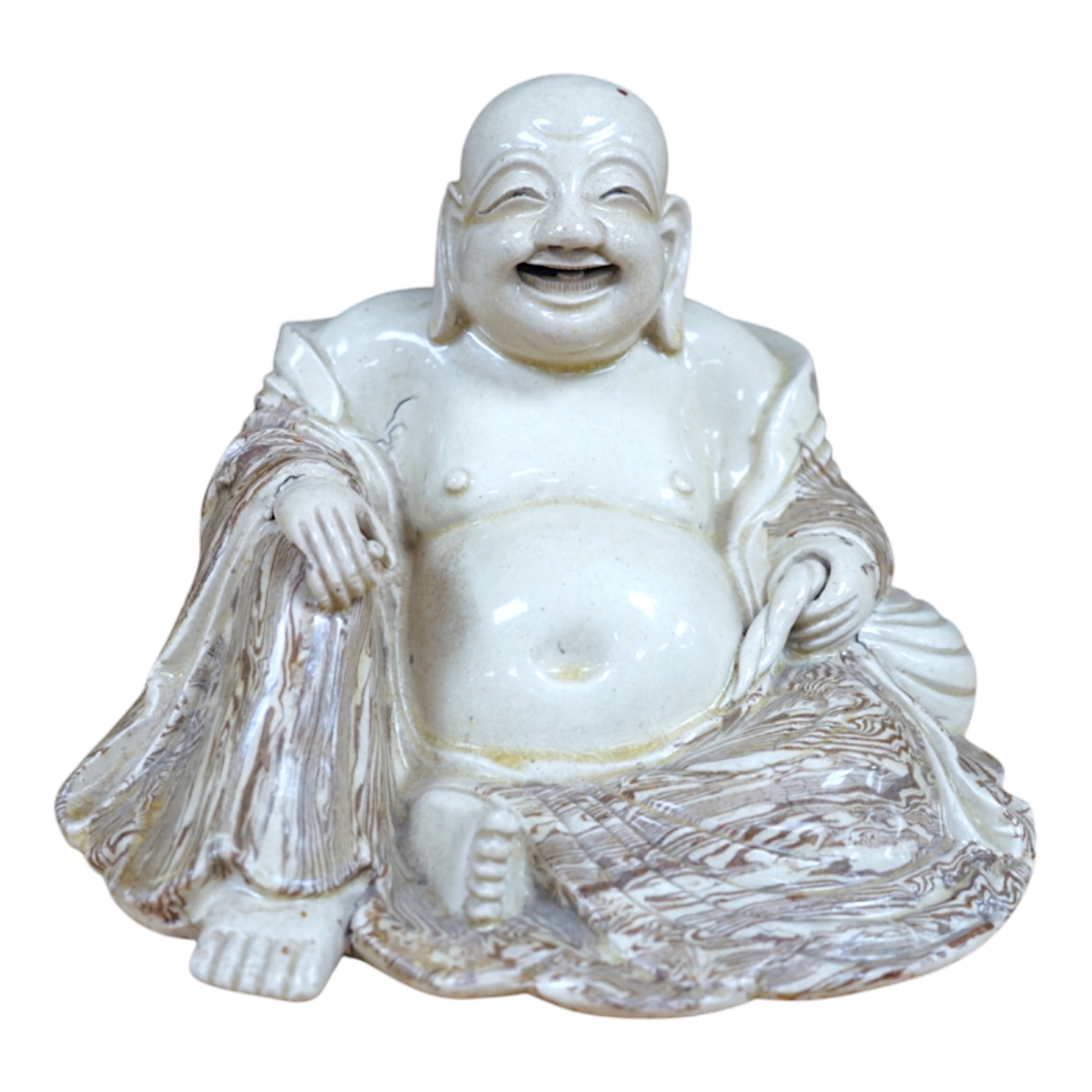 A Chinese marbled pottery figure of Budai, early 20th century, 13cm high. Condition - fair to good.